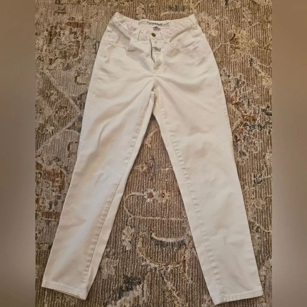 Girbaud jeans sz 7/8. Please see pics for tiny spots on bottom of legs